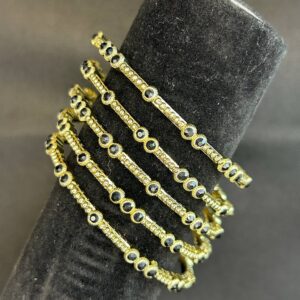 GOLD BRACELET WITH BLACK STONES